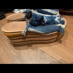 Chole denim and white Fringe wedge sandal.